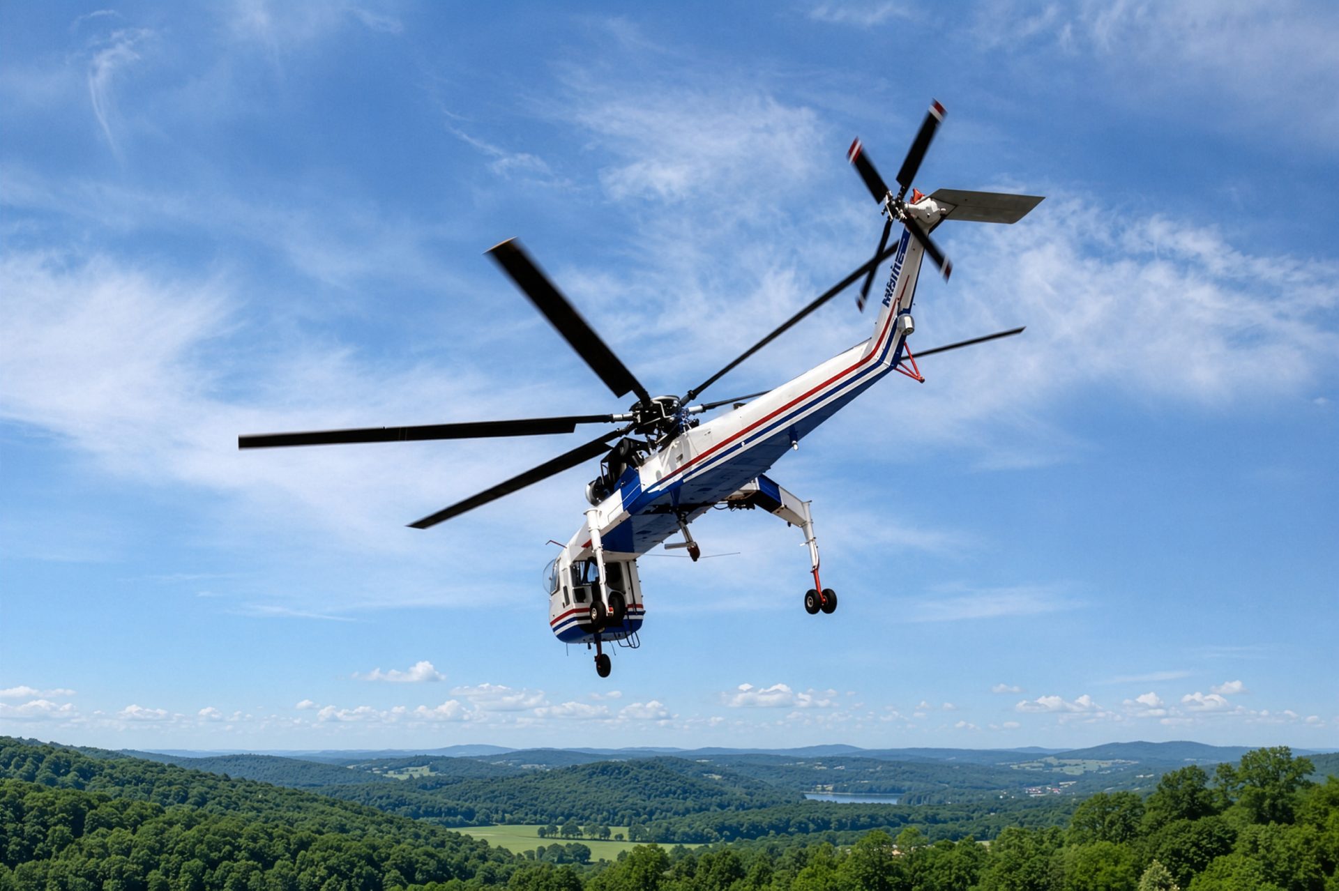 Heavy lift helicopter banking over forested roadless terrain