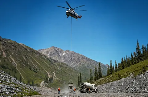 Heavy lift helicopter working over an industrial terrain site
