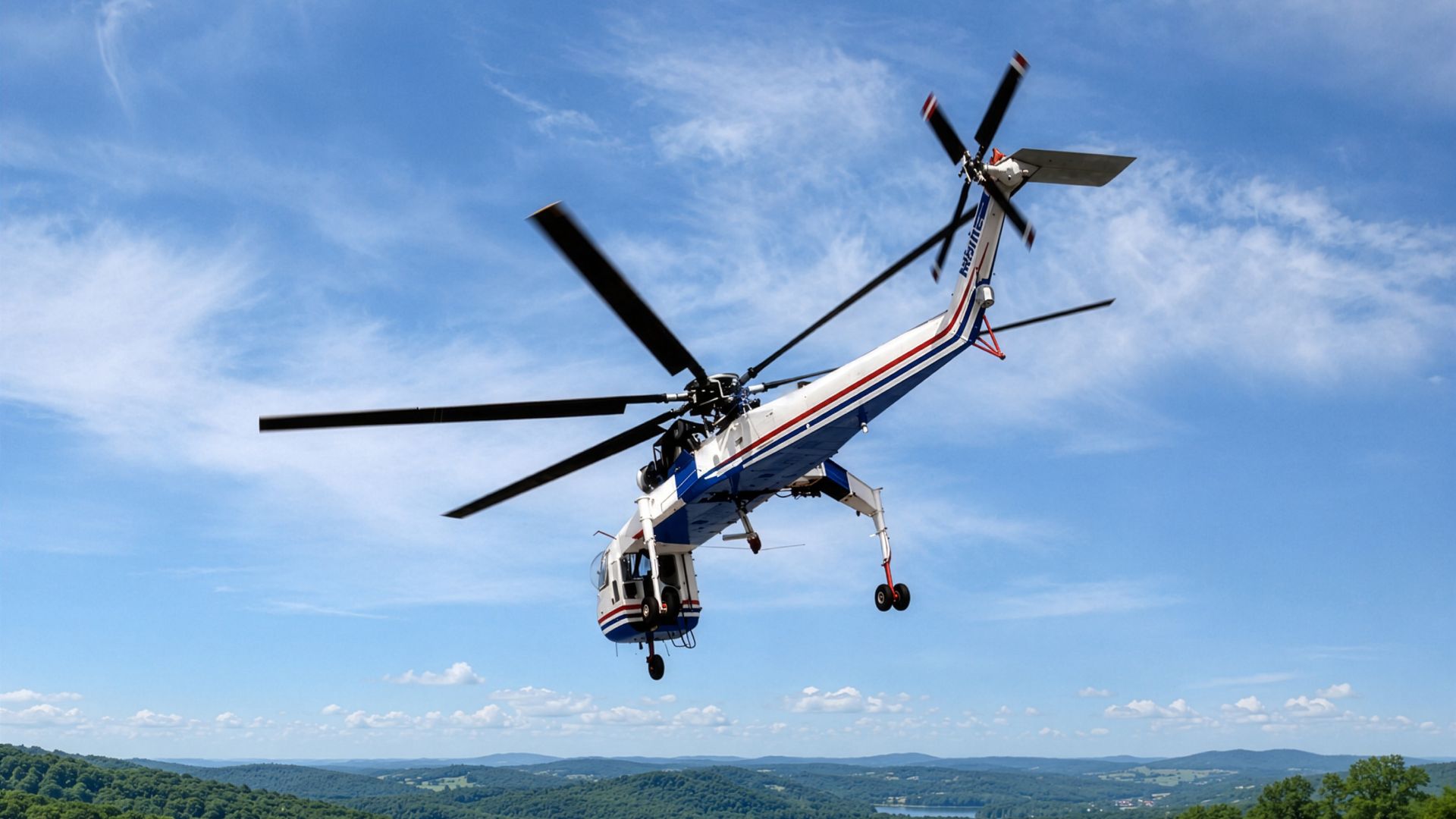 Sikorsky S-64 Air Crane flying over a wooded infrastructure corridor